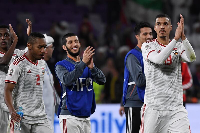 UAE players soak in the applause from their supporters. EPA