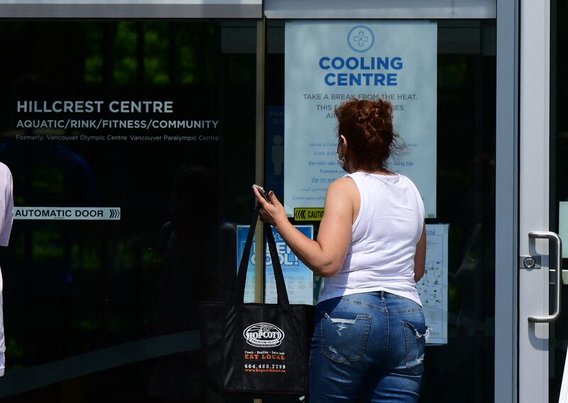 People enter the Hillcrest Community Centre where they can cool off during the extreme hot weather in Vancouver, British Columbia, Canada, on June 30, 2021. AFP