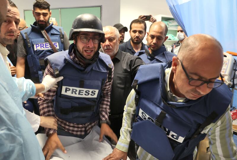 Journalists escort the body at the hospital in Jenin. AFP