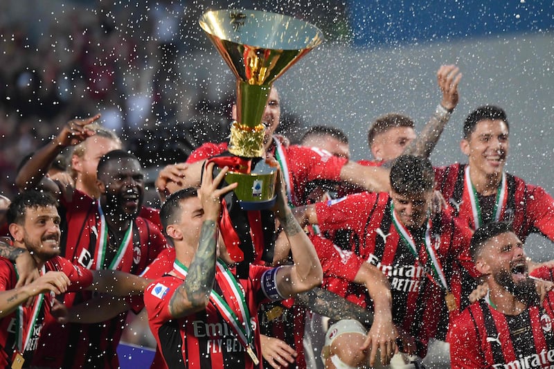 AC Milan defender Alessio Romagnoli lifts the Serie A trophy. AFP