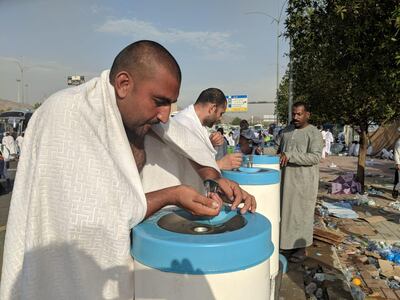 Pilgrims re-hydrate under the beating sun.