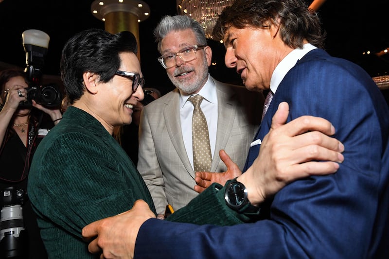 From left, actor Ke Huy Quan and filmmaker Christopher McQuarrie with Cruise. AFP