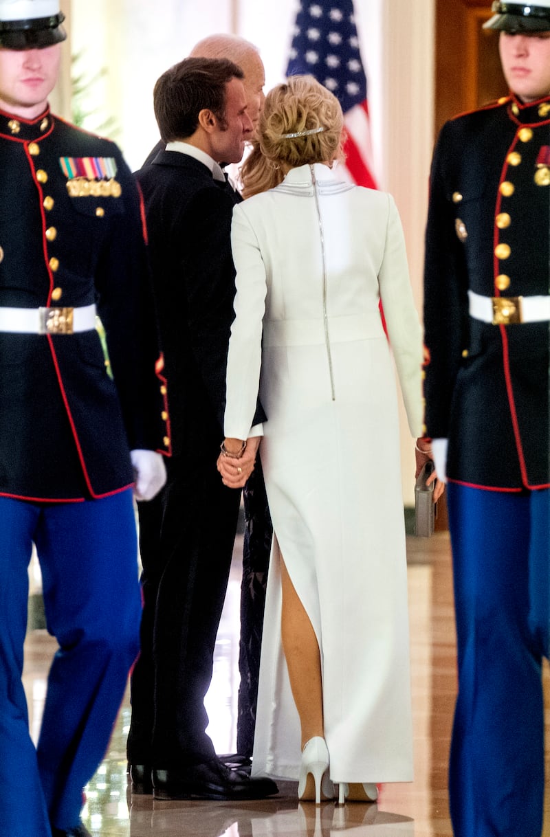 Mr Macron and his wife Brigitte in a candid moment on the North Portico of the White House. EPA