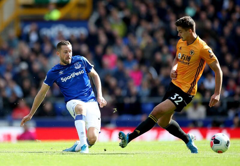 Everton's Gylfi Sigurdsson in action with Wolverhampton Wanderers' Leander Dendoncker. Reuters