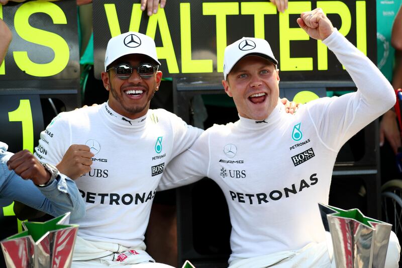 MONZA, ITALY - SEPTEMBER 03:  Race winner Lewis Hamilton of Great Britain and Mercedes GP celebrates with second place Valtteri Bottas of Finland and Mercedes GP after` the Formula One Grand Prix of Italy at Autodromo di Monza on September 3, 2017 in Monza, Italy.  (Photo by Dan Istitene/Getty Images)