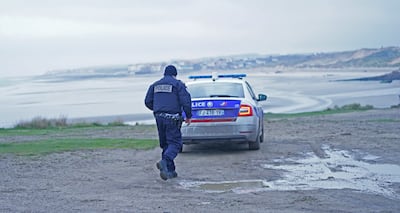 French police look out over the coast at Wimereux, north of Boulogne in northern France, at a stretch of beach believed to be used by migrants looking to cross the English Channel. PA