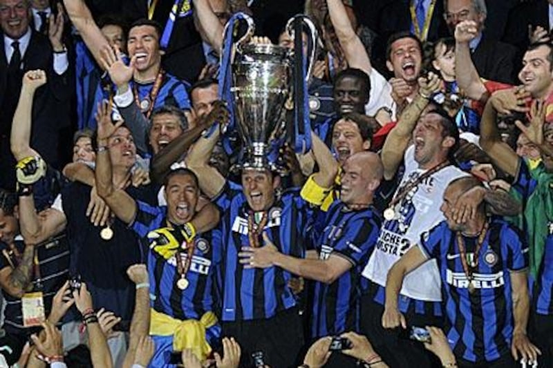 Inter's jubilant players celebrate with the European Cup after beating Bayern Munich in Madrid.