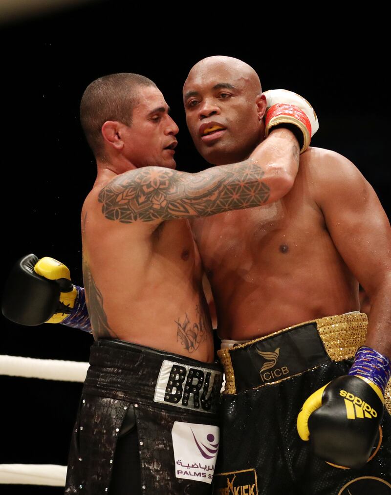 Anderson Silva and Bruno Machado (L) embrace after their bout.