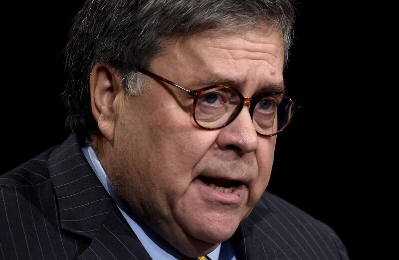 (FILES) In this file photo taken on December 03, 2019 US Attorney General William Barr participates in an awards ceremony for 19 law enforcement officers for their efforts in criminal investigations, field operations and innovations in community policing, in the Great Hall of the Justice Department in Washington, DC. Attorney General William P. Barr said February 13, that President Trump's attacks on the Justice Department had made it "impossible for me to do my job" and asserted that "I’m not going to be bullied or influenced by anybody." Barr has faced growing scrutiny since Tuesday, when four prosecutors handling the case of President Trump's longtime friend Roger Stone withdrew from the proceedings amid a dispute over how long he should spend in prison. / AFP / Olivier Douliery

