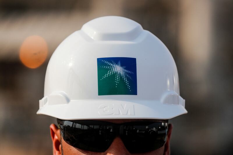 A Saudi Aramco employee in a company-branded helmet. Saudi Aramco announced in March 2020 that it had been directed to increase oil capacity to 13 million bpd by 2027. Reuters