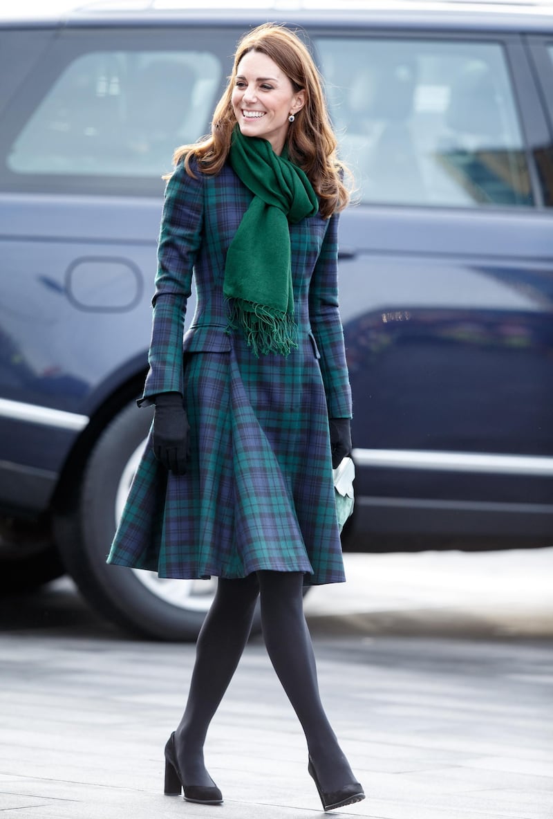 The Duchess of Cambridge wears a McQ Black Watch tartan coat as she arrives at the opening of the V&A Dundee Design Museum, in Scotland on January 29. The coatdress is accessorised with a green Pickett London scarf, a Manu Atelier bag, Tod pumps and Cornelia James gloves. EPA