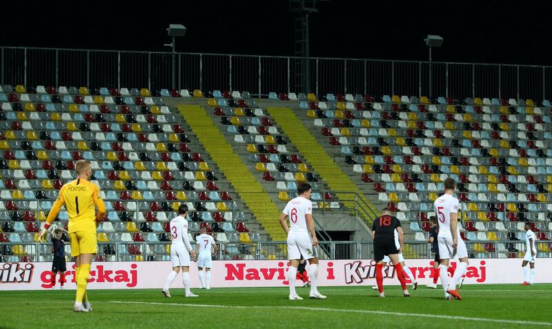 General view of empty stands during the match. Reuters