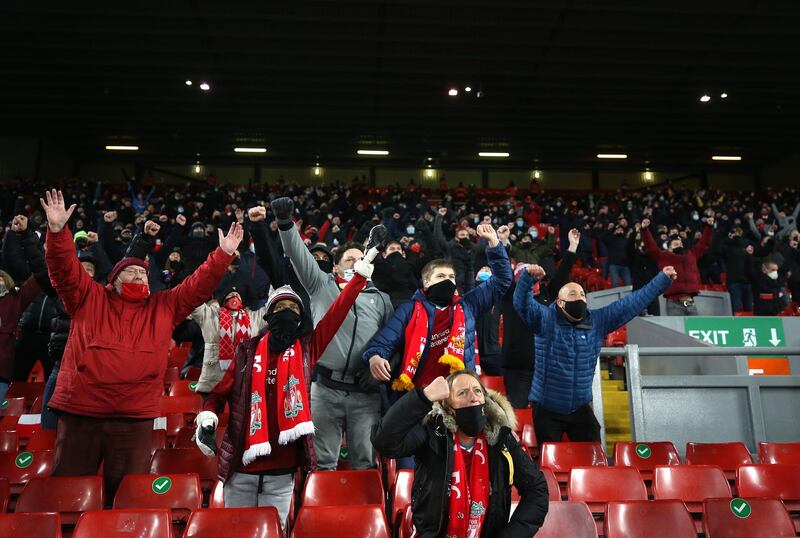 Liverpool fans celebrate their sides second goal scored by Georginio Wijnaldum. Getty