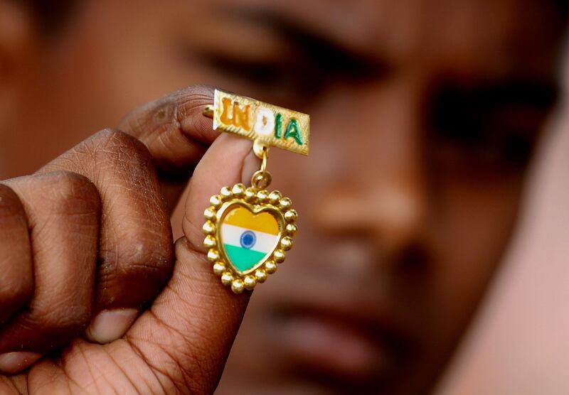 A boy displays a tri-colour pin during Independence Day celebrations in Bangalore. Jagadeesh NV /  EPA