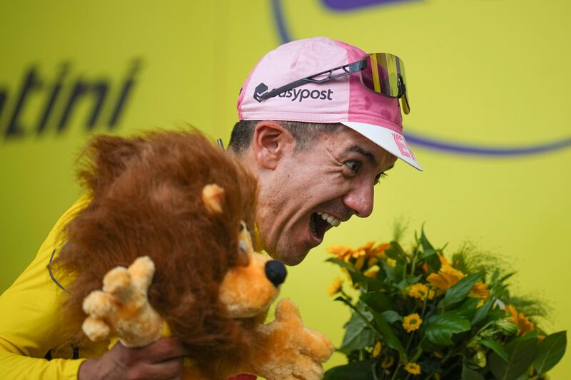 Ecuador's Richard Carapaz wearing the overall leader's yellow jersey on the podium after Stage 3 of the Tour de France between Piacenza and Turin on Monday, July 1, 2024. AP 