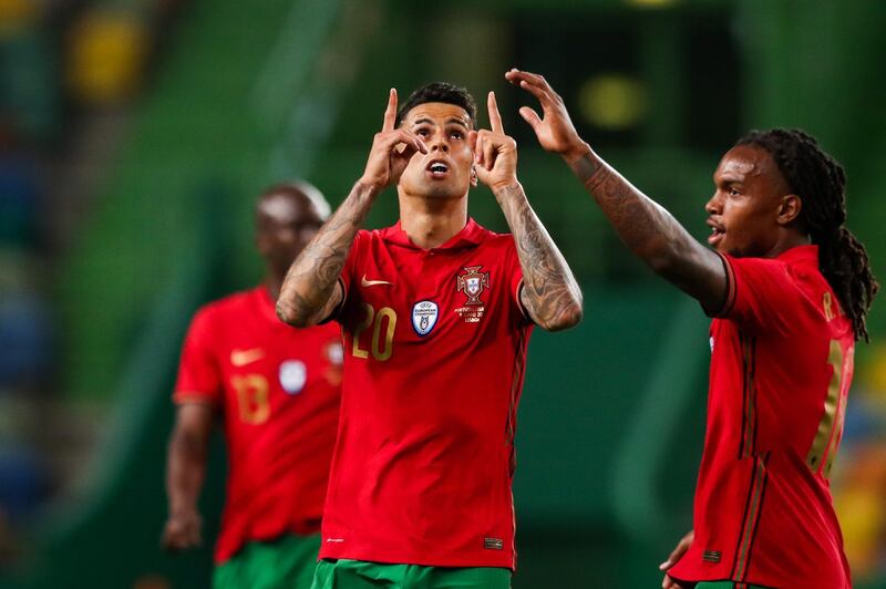 Portugal's Joao Cancelo celebrates scoring his side's third goal. EPA