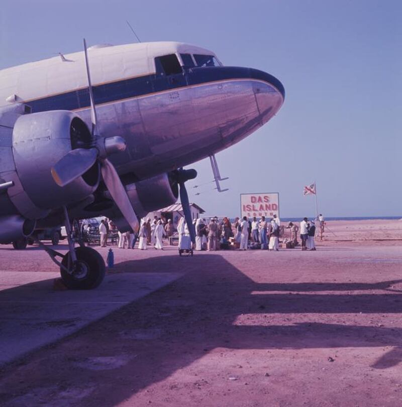 Archival photograph of the Trucial States shot by photographer Guy Gravett in 1962. A Douglas DC-3 operated by Gulf Aviation at Das Island airport in 1962. The flag carries the emblems of BP and Abu Dhabi Marine Areas (ADMA)

Eds note** Karen *** Permission needed before use. Contact Crispin Gravett Cpgravett@aol.com. $150 one print use and 5 years online. 