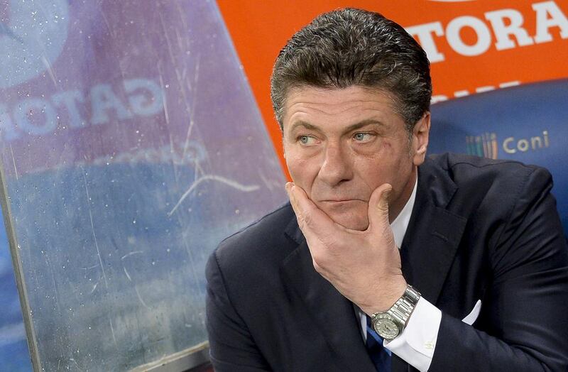 Inter Milan coach Walter Mazzarri looks on before the Serie A match against Roma on March 1, 2014, at Rome's Olympic stadium. Andreas Solaro / AFP