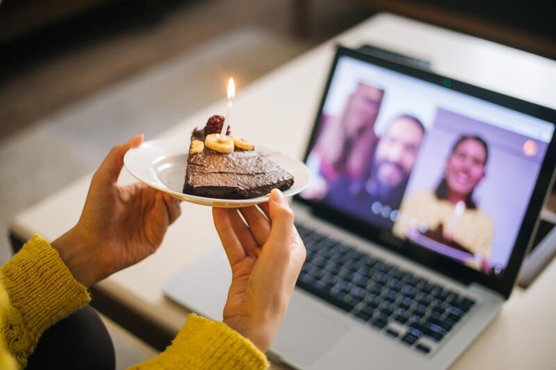 Woman celebrating birthday with video conference