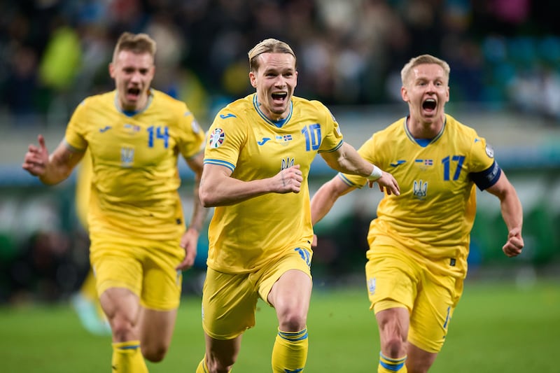 Mykhailo Mudryk of Ukraine, centre, celebrates scoring his team's winning goal during the Uefa Euro 2024 play-off victory over Iceland. Getty Images