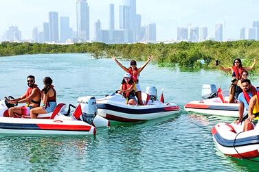 Alternative things to do in Abu Dhabi this summer, from captaining a speedboat through the mangroves to stargazing in the desert. Courtesy Rhino Rides 