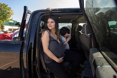 A pregnant woman and her family that fled Yellowknife as the fires approached. AP