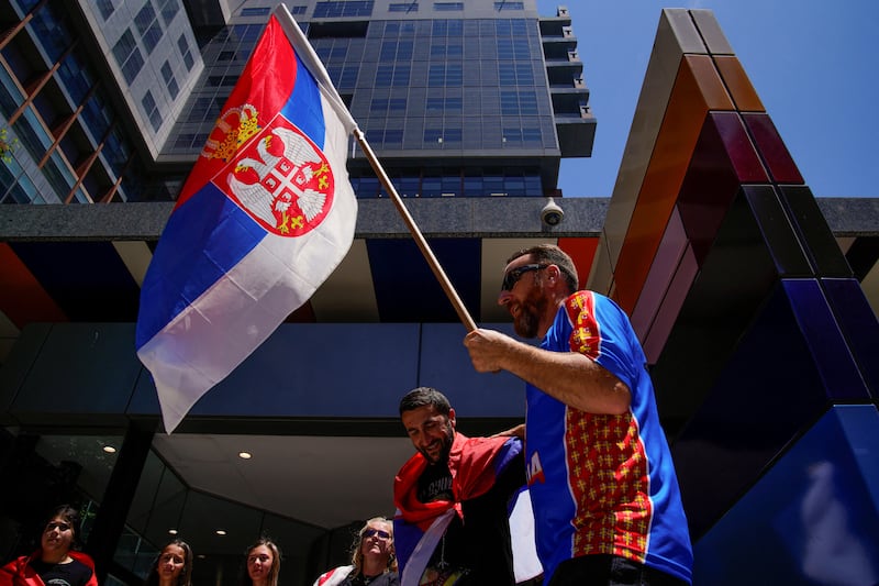 Supporters of Serbian tennis player Novak Djokovic rally outside the Federal Court of Australia. Reuters
