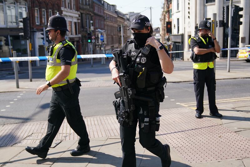 Police officers on patrol in Nottingham city centre, after three people were found dead. PA