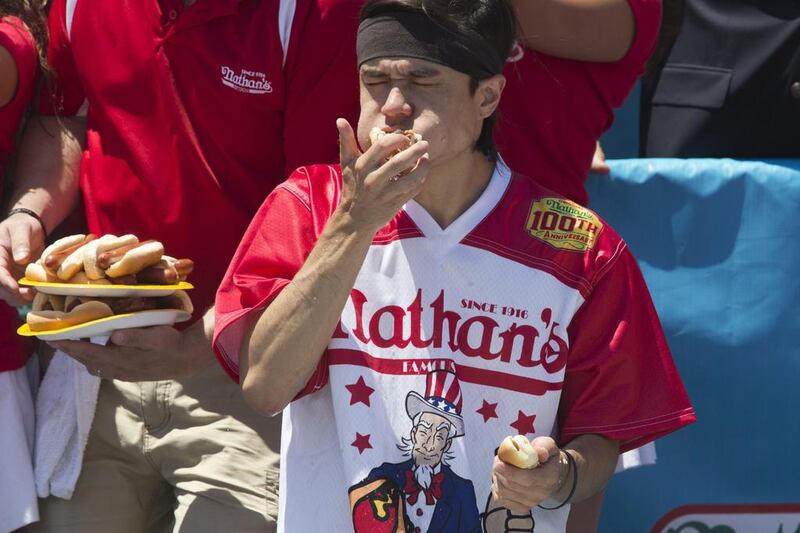 Matt Stonie competes in Nathan’s Famous Fourth of July International Hot Dog Eating Contest men’s competition. Mary Altaffer / AP Photo