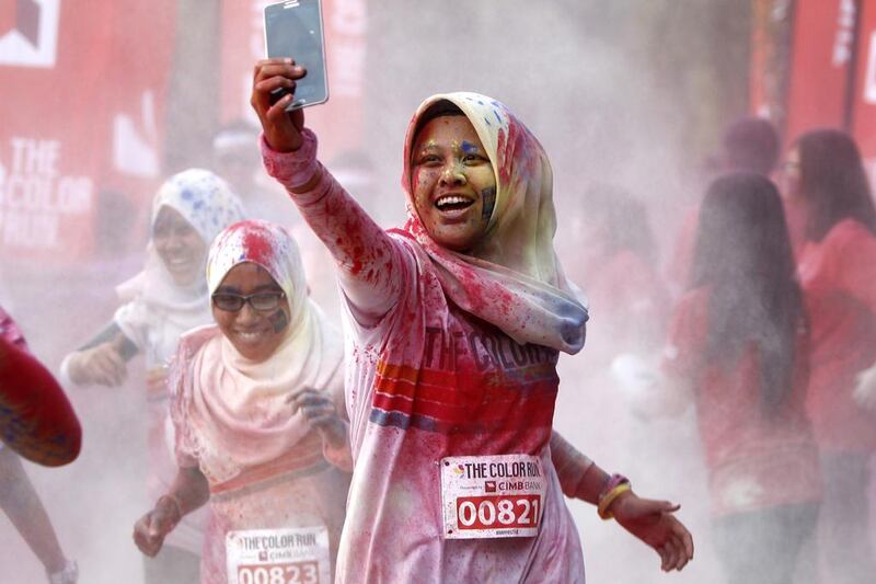 What does excessive use of selfies on social media say about our psychological state? Photo: Lai Seng Sin / AP