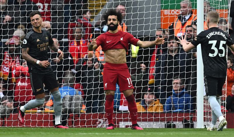 Liverpool striker Mohamed Salah reacts after missing a penalty against Arsenal at Anfield. AFP