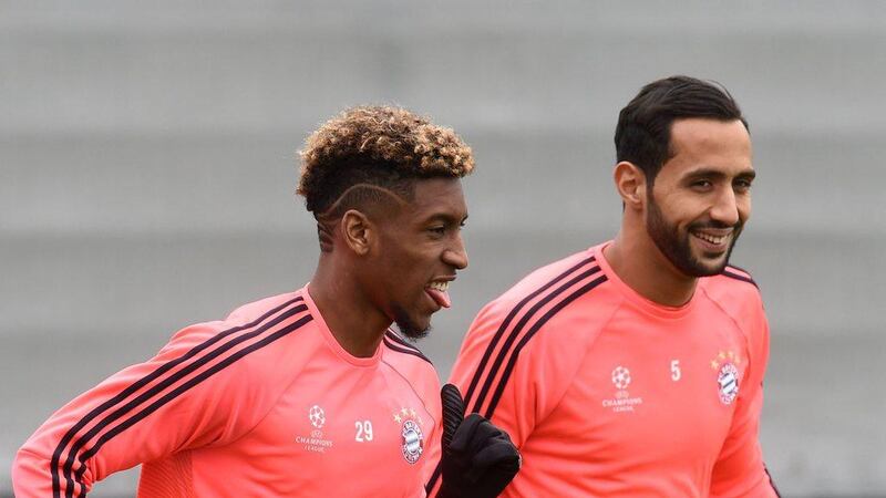 Bayern Munich’s French defender Kingsley Coman (L) and Bayern Munich’s Moroccan defender Medhi Benatia attend the final team training on the eve of the Champions League semi-final, first-leg football match between Atletico Madrid and Bayern Munich in Munich, southern Germany, on April 26, 2016. AFP / CHRISTOF STACHE