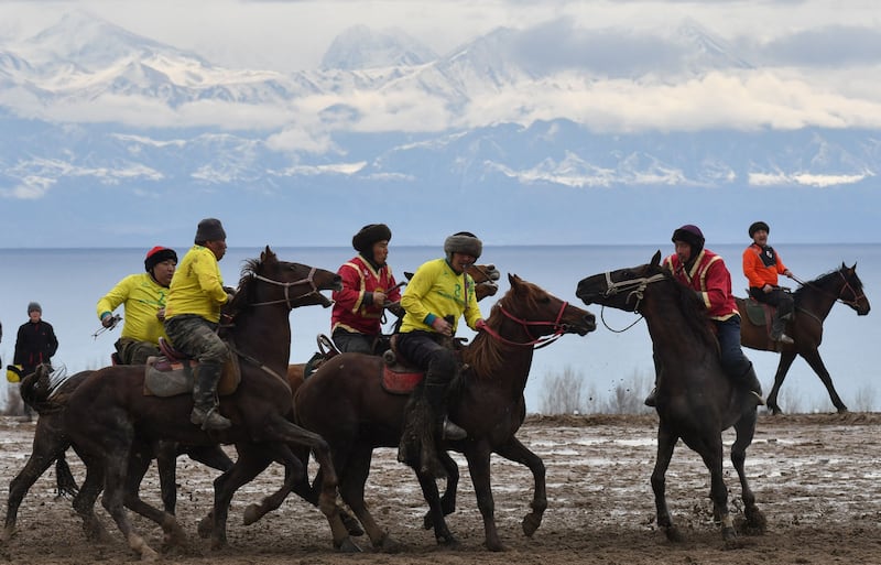 Kyrgyz riders play the traditional Central Asian sport of Kok boru or Buzkashi, marking the first day of Iranian New Year. AFP