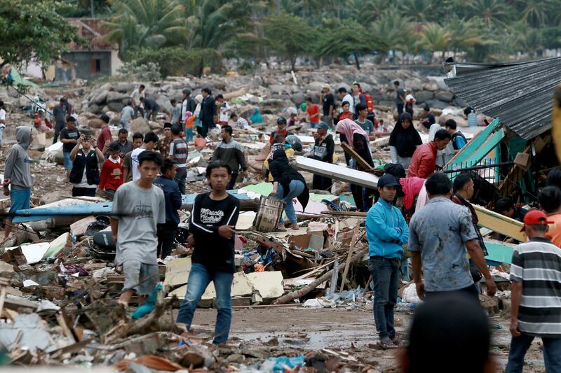 Rescuers and residents look for survivors along the coast in South Lampung on South Sumatra. AFP