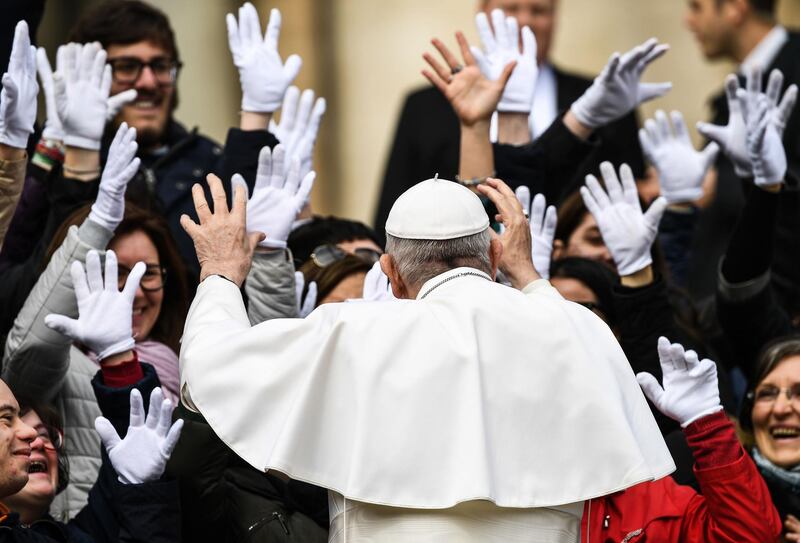 Pope Francis gestures as he interacts with people at the end of the weekly general audience at St. Peter's square in the Vatican. AFP