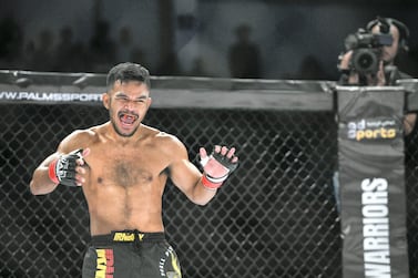 Abu Dhabi, United Arab Emirates - Rolando Dy from the Philippines wins the feather-weight round against Yerzhan Yestanov from Kazakhstan at the UAE Warriors MMA event at the Mubadala Arena, Zayed Sports City. Khushnum Bhandari for The National