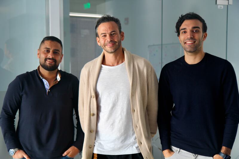 Invia chief executive Yehia Ashour, centre, with chief operating officer Ahmed Zeinhom, left, and chief information officer Omar Aboulmagd. Photo: Invia