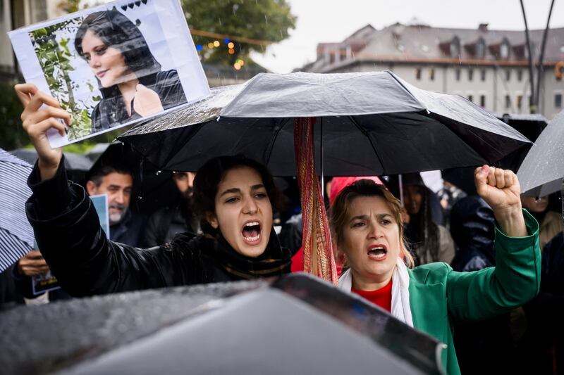 People take part in a protest in Lausanne, Switzerland. EPA