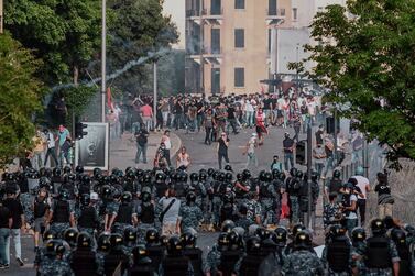 Protesters marching against the country's economic crisis clash with the security forces in Beirut. EPA