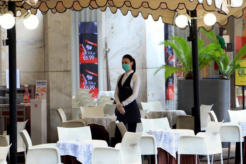Empty restaurants in downtown are seen during Phase 2 of the Covid-19 emergency, in Milan, Italy. EPA