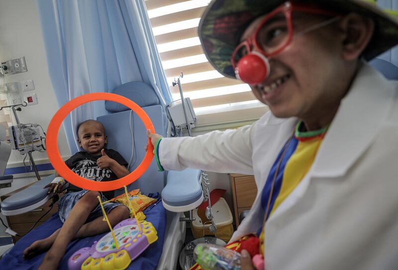 A Palestinian clown entertains children with cancer who will receive chemotherapy treatment and medical care inside children cancer ward, opened by the US charity Palestine Children Fund, at Al Rantisi hospital in Gaza City.  EPA