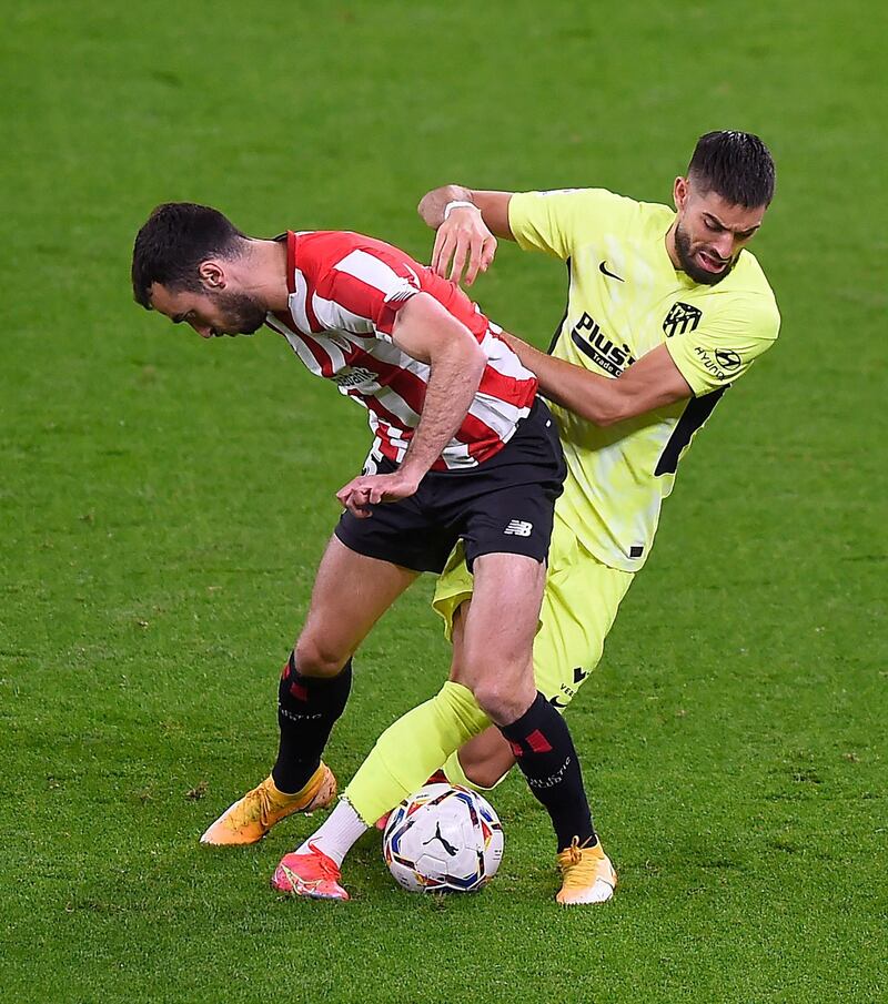 Athletic Bilbao's Spanish defender Inigo Lekue vies with Atletico Madrid's Belgian midfielder Yannick Carrasco. AFP