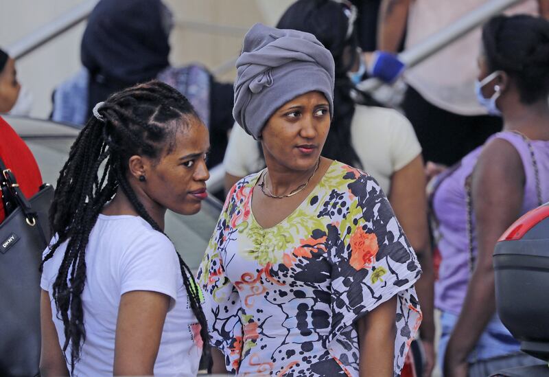 Ethiopian domestic workers wait outside their country's consulate to register for repatriation, in Hazmieh suburb of the Lebanese capital Beirut. AFP