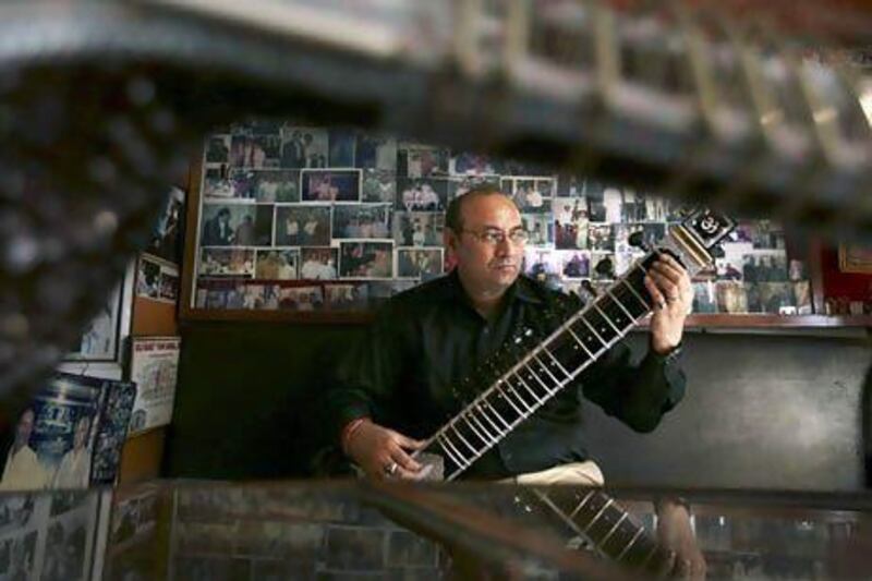 Sanjay Sharma is a third-generation instrument maker. Kevin Frayer / AP Photo