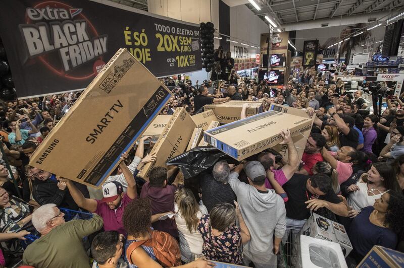 Brazilians scramble for televisions in a store in Sao Paulo, Brazil.  Sebasttiao Moreira / EPA