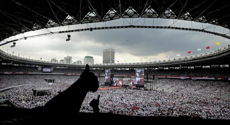 Indonesian supporters give the thumbs up as a symbol of support as thousands of others attend the final campaign rally of incumbent president Joko Widodo at Bung Karno stadium in Jakarta, Indonesia, 13 April 2019. EPA