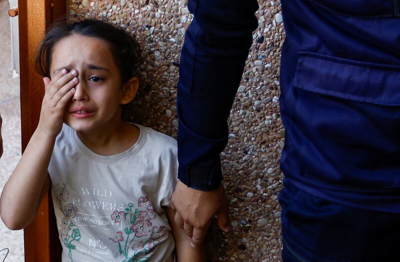 A girl mourns the death of members of the Samour family, who were killed in Israeli strikes on their house in Khan Younis in the southern Gaza Strip. Reuters