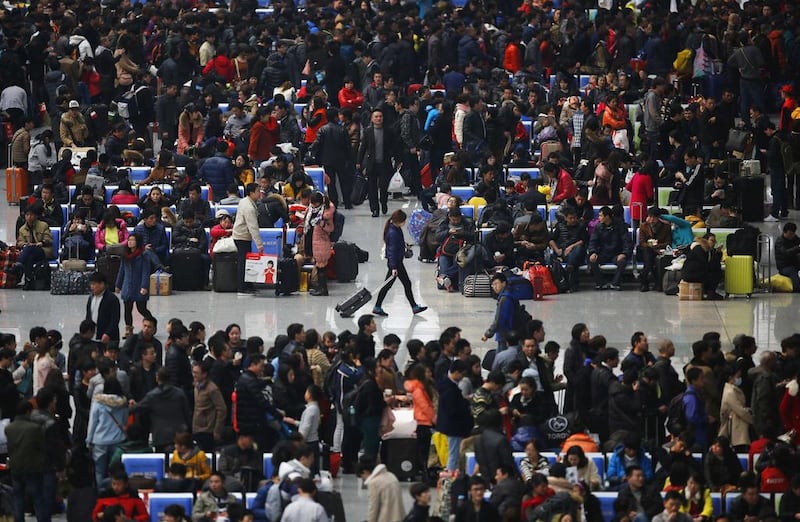 Passengers wait at Hongqiao train station in Shanghai on January 28, 2014. About 3.62 billion trips will be made during the 40-day Spring Festival travel rush, which began January 16, the Xinhua News Agency reported.  Carlos Barria / Reuters photo