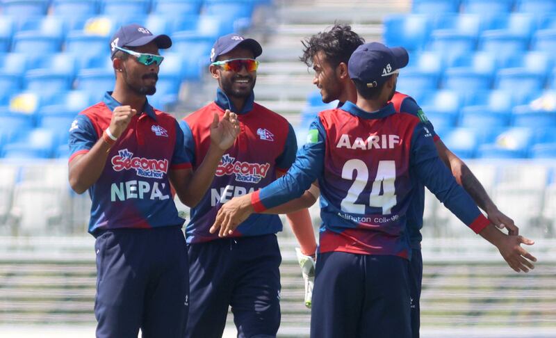 Nepal celebrate a wicket against Oman in Muscat.