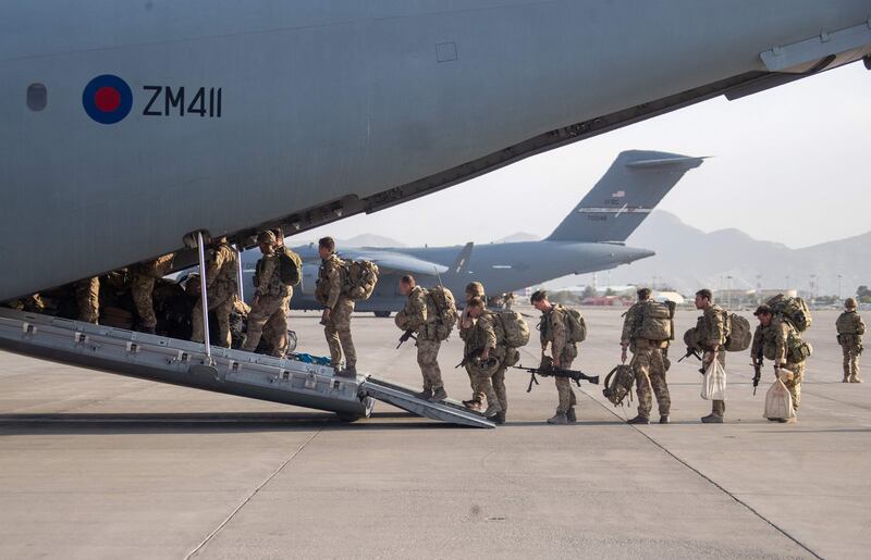 British troops board an RAF plane at the airport in Kabul. AFP